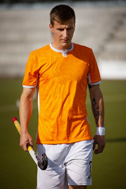 Field hockey player training and practicing the sport on grass