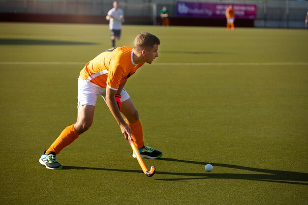 Field hockey player training and practicing the sport on grass