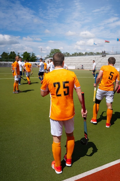 Free photo field hockey players during a tournament game