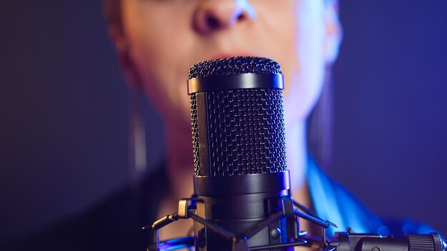 fierce iconic rock star woman sings passionately into the microphone