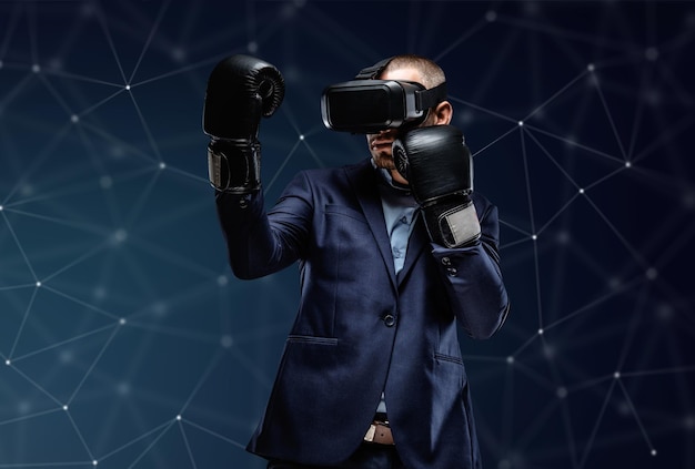 Бесплатное фото Боец в костюме с очками виртуальной реальности на голове на футуристическом фоне.