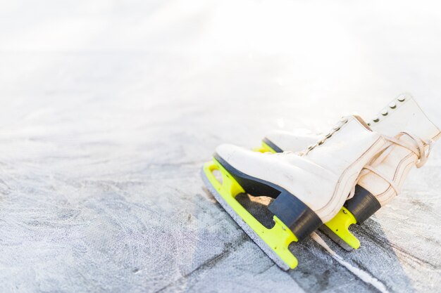 Free photo figure skates on scratched ice