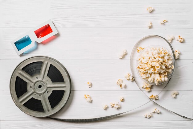 Film bobbin and popcorn with glasses