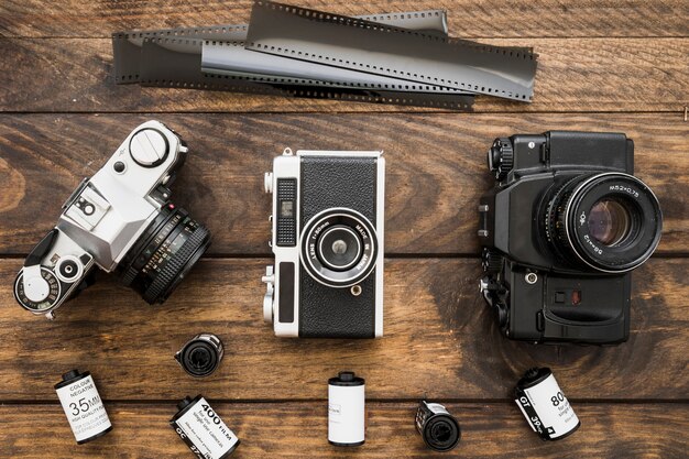 Film and cameras on lumber tabletop