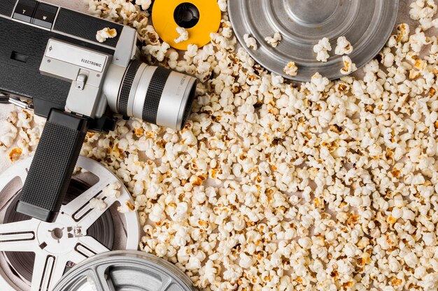 Film reel and camcorder camera on popcorns