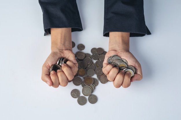 Free photo finance and accounting concept. business woman holding coin on desk