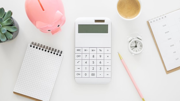 Free Photo finance elements arrangement with empty notepad and calculator