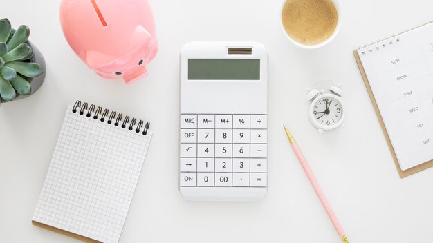 Finance elements arrangement with empty notepad and calculator