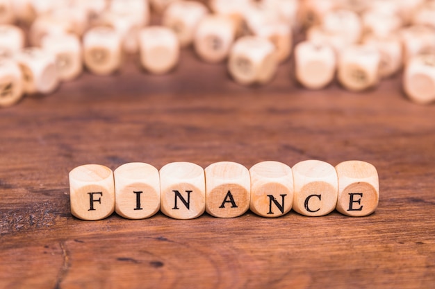 Finance text on wooden dices