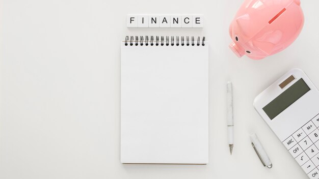 Financial elements arrangement with empty notepad