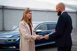 Free photo financial independent woman buying new car