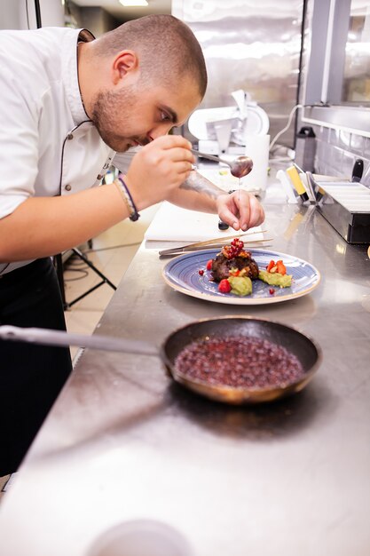 Fine cuisine design made by Chef in his restaurant kitchen