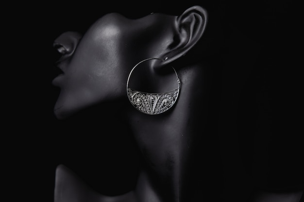 Fine jewelry promotion in the ears of a woman