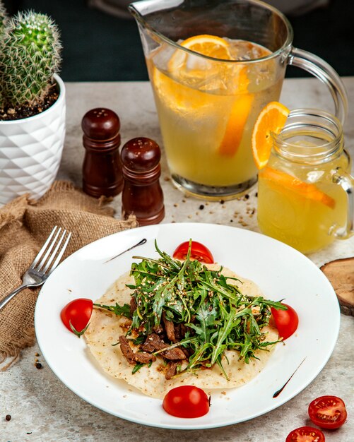 Finely chopped fried meat with greenery