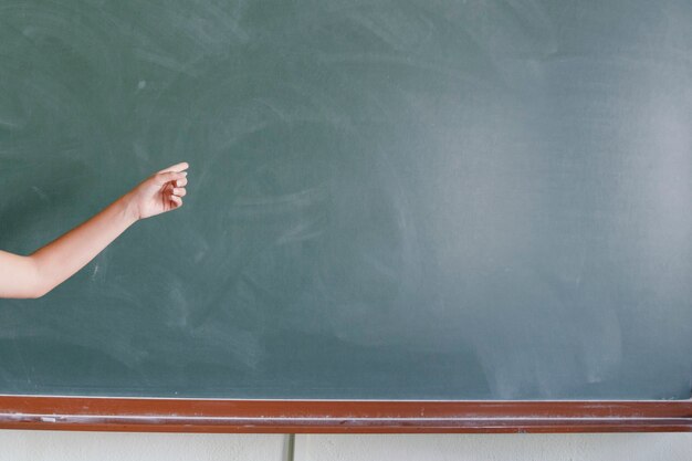 Finger pointing the blackboard