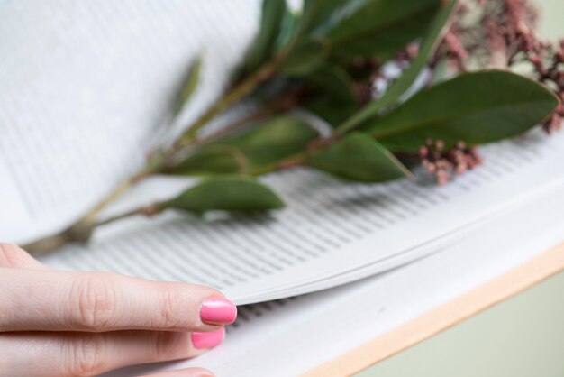 Fingers close-up of person with book