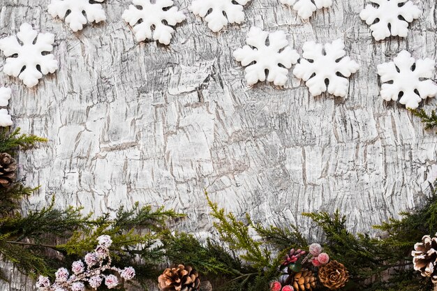 Fir tree branches with snowflakes 