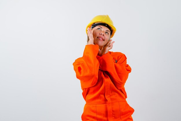 Firewoman in her uniform with a safety helmet