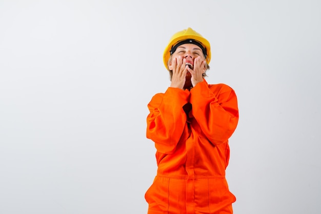 Firewoman in her uniform with a safety helmet