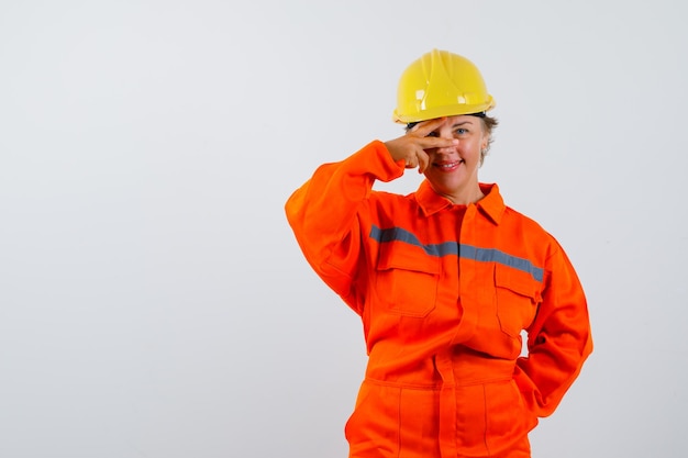 Firewoman in her uniform with a safety helmet