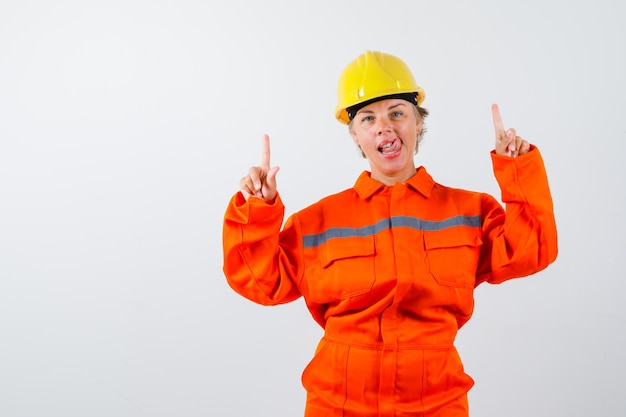 Free photo firewoman in her uniform with a safety helmet