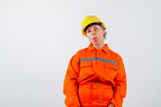 Firewoman in her uniform with a safety helmet