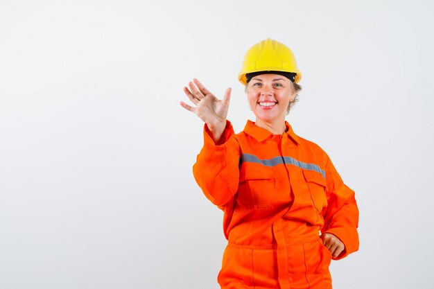 Firewoman in her uniform with a safety helmet