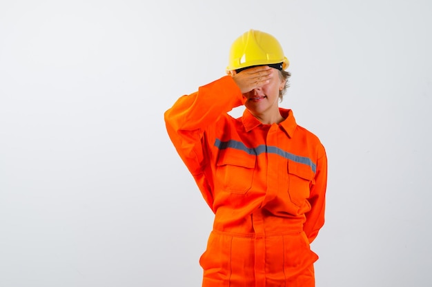 Firewoman in her uniform with a safety helmet