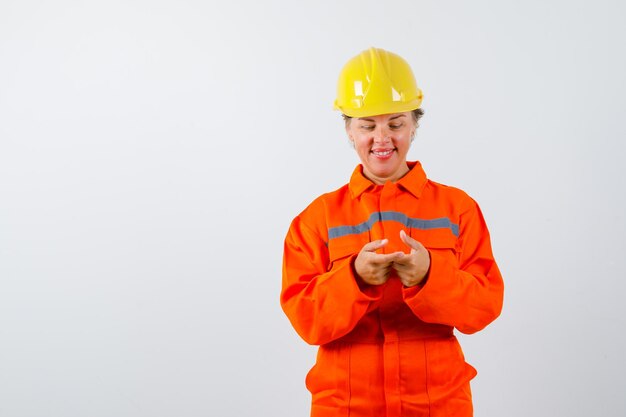 Firewoman in her uniform with a safety helmet