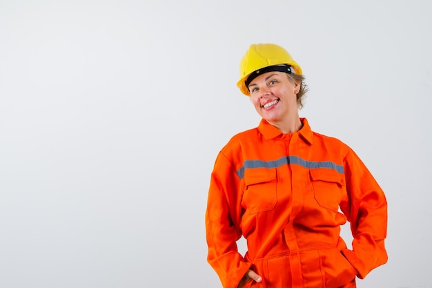 Firewoman in her uniform with a safety helmet