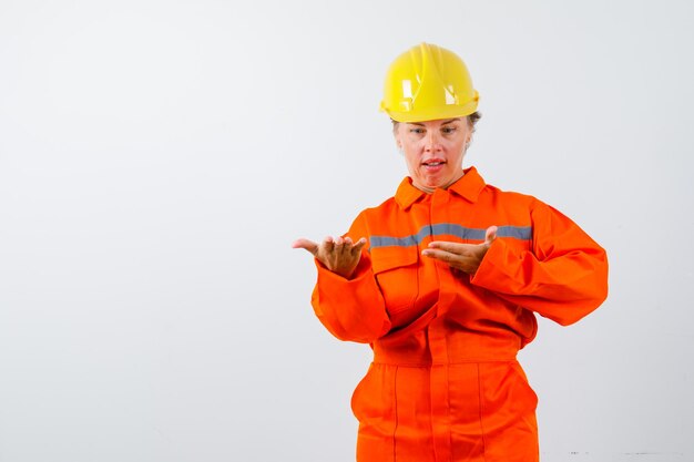 Firewoman in her uniform with a safety helmet