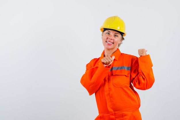 Firewoman in her uniform with a safety helmet