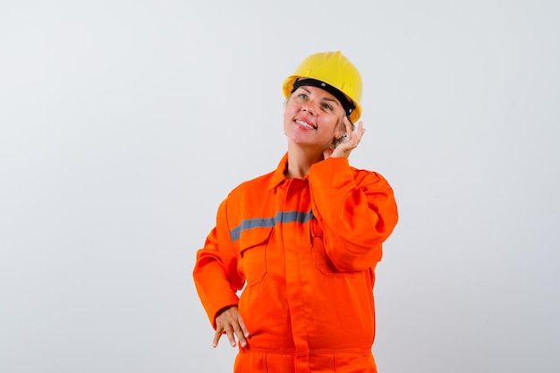 Firewoman in her uniform with a safety helmet