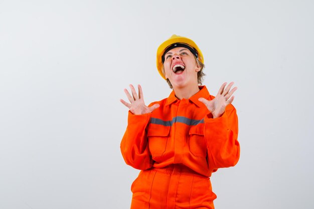 Firewoman in her uniform with a safety helmet