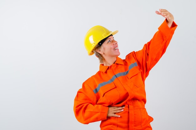 Firewoman in her uniform with a safety helmet