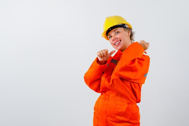 Firewoman in her uniform with a safety helmet