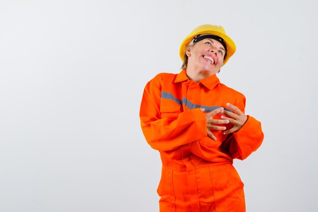 Firewoman in her uniform with a safety helmet