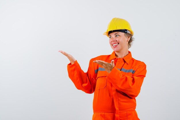 Firewoman in her uniform with a safety helmet