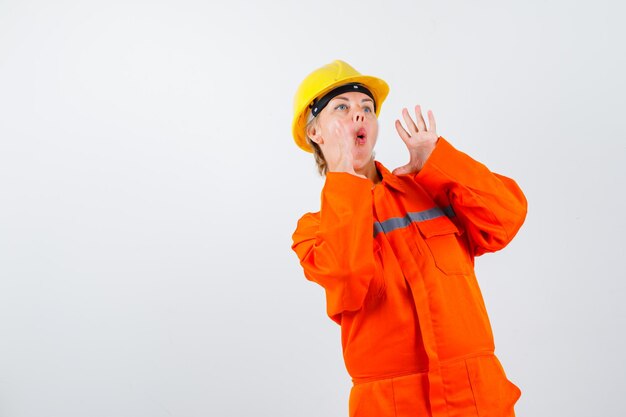 Firewoman in her uniform with a safety helmet