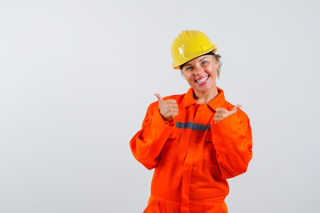 Free photo firewoman in her uniform with a safety helmet