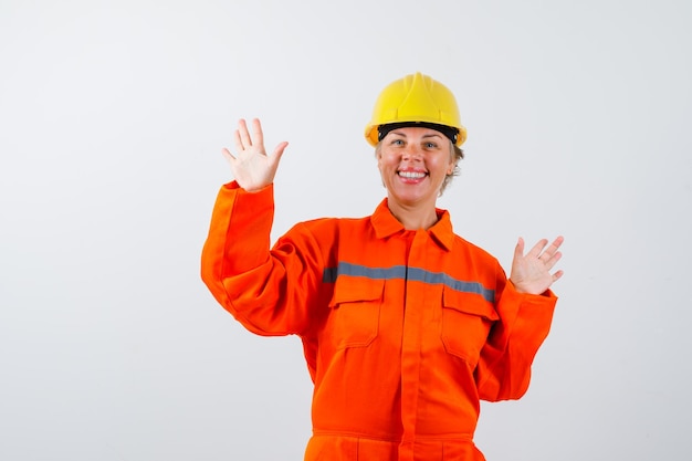 Firewoman in her uniform with a safety helmet