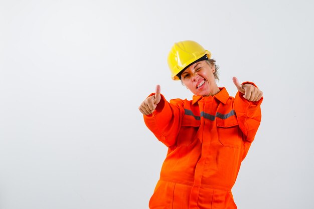 Free photo firewoman in her uniform with a safety helmet