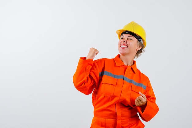 Firewoman in her uniform with a safety helmet