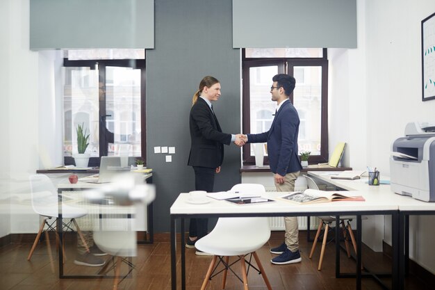 Free photo firm handshake of business partners