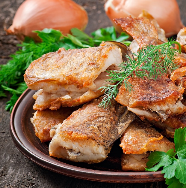 Free photo fish dish - fried fish and herbs