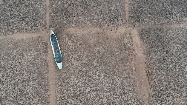 The fishing boat on the dry ground, top view