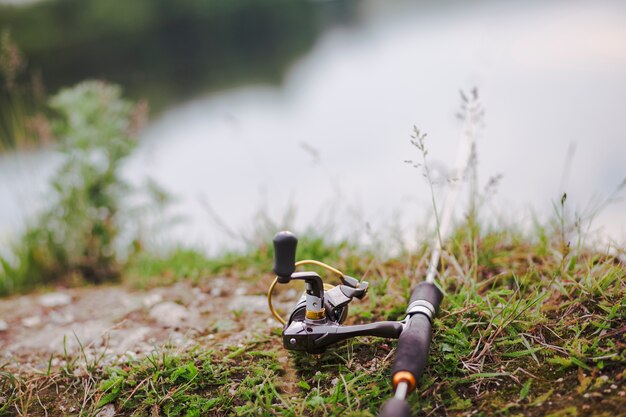 Fishing rod on green grass