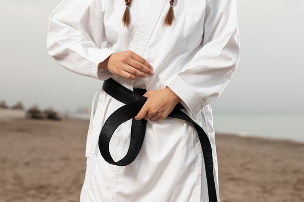 Fit athlete in martial arts costume