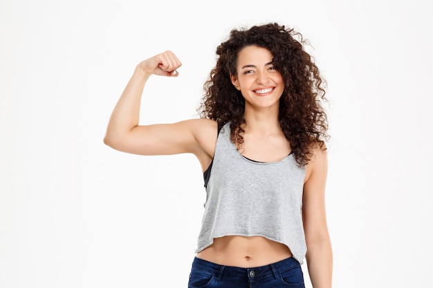 Fit curly girl doing fitness exercises