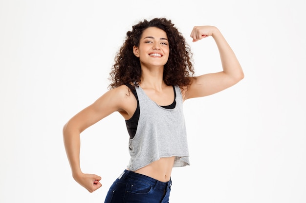 Fit curly girl doing fitness exercises